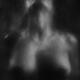 Abstract nude sexy woman with ecstatic moaning expression behind a wet... (thumbnail)