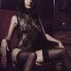 Boudoir portrait of a seductive woman with short dark hair wearing she... (thumbnail)
