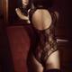 Sensual boudoir portrait of a sexy woman in lace underwear with her fa... (thumbnail)