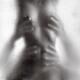Hands of two men caressing body of half naked woman behind wet shower... (thumbnail)