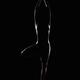 Nude woman figure outline of Vriksasana standing tree yoga pose on bla... (thumbnail)
