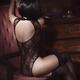 Woman with short hair wearing sexy black lingerie and stockings sittin... (thumbnail)