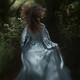 Dramatic rear view portrait of a woman running away into a deep dark f... (thumbnail)