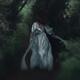 Woman running away into a deep dark forest in her long dress flowing b... (thumbnail)