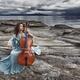 Woman with a tranquil thoughtful expression gracefully playing cello i... (thumbnail)