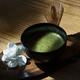 Bowl of Japanese Matcha green tea with a bamboo whisk Artistic still l... (thumbnail)