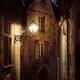 Dramatic scenery of an old street lit by a lamp in a French medieval t... (thumbnail)