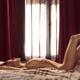Sexy young woman lying naked stretched on a bed by a window with her l... (thumbnail)