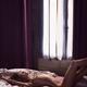 Sexy nude beautiful woman lying relaxed on a bed by a window... (thumbnail)