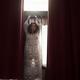 Sexy woman in see-through nightgown standing by the window in a seduct... (thumbnail)