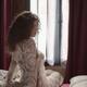 Boudoir portrait of beautiful sexy woman sitting in bed just awaken we... (thumbnail)