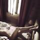 Nude woman lying on a bed naked with her legs on a headboard Abstract... (thumbnail)