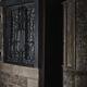 Half open entrance door showing dark house interior from the street at... (thumbnail)