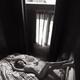 Beautiful nude woman lying on a bed naked with her legs on a headboard... (thumbnail)
