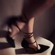 Artistic closeup of woman legs in sexy black high-heels walking down t... (thumbnail)
