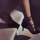 Closeup of woman legs in black high heel shoes walking down the stairs... (thumbnail)