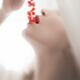 Closeup of a woman sensual mouth with open lips eating red currants... (thumbnail)
