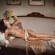 Beautiful sexy nude woman lying on a couch naked with grapes in her ha... (thumbnail)