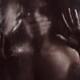 Man hand covering woman mouth silencing or suffocating her behind wet... (thumbnail)