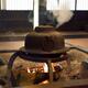 Japanese cast iron kettle steaming on fire in a sunken hearth Irori Sh... (thumbnail)