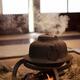 Steaming iron kettle Kama on firewood in a traditional Japanese house... (thumbnail)