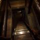 Descending dark wooden staircase in a floor opening of a house Cellar... (thumbnail)