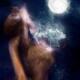 Nude native woman performing shamanic purification ritual dance with s... (thumbnail)