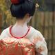 Maiko closeup of back in kimono with red collar showing skin makeup on... (thumbnail)