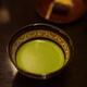 Bowl of Japanese Matcha ceremonial green tea and wagashi confection on... (thumbnail)