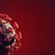 Coronavirus COVID-19 virus particle on dark red background scientific... (thumbnail)