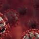Coronavirus COVID19 virus particles on dark red background conceptual... (thumbnail)