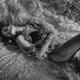 Beautiful sexy woman in swimsuit lying in sea water splashing waves hi... (thumbnail)