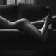 Beautiful sexy nude woman lying on a couch body curvy outline Body par... (thumbnail)