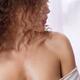 Closeup of a woman bare shoulder with glowing healthy skin Skin care B... (thumbnail)