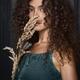 Beautiful girl with bushy curly hair and expressive big eyes dreamy fi... (thumbnail)