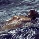 Muscular man bare torso in rushing water of a river Dynamic dramatic f... (thumbnail)