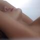 Artistic closeup of sensual nude woman lips and neck Making love in be... (thumbnail)