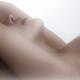 Sensual closeup of nude woman neck and lips in soft white light Making... (thumbnail)