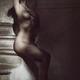 Black and white art nude portrait of a beautiful woman sitting naked o... (thumbnail)