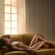 Beautiful nude woman with sexy shiny golden skin and sensual curvy sli... (thumbnail)
