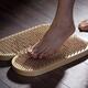 Woman foot stepping on Sadhu Board Yogic board of sharp metal nails... (thumbnail)