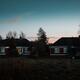 Residential houses on a street in dramatic twilight suburban town scen... (thumbnail)