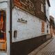 Old narrow cobbled street with houses and pubs in Canterbury England... (thumbnail)