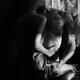 Romantic sensual portrait of a sexy couple embracing in dark indoor se... (thumbnail)