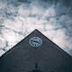 Old church house with a clock under dramatic sky in France... (thumbnail)