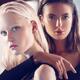 Two beautiful women blond and brunette female couple with sleek stylis... (thumbnail)