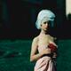Surreal fashion portrait of a beautiful young woman in a tight pink dr... (thumbnail)