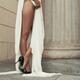 Sexy long woman's legs in black high-heel shoes standing next to... (thumbnail)