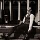 Elegantly dressed man sitting by a fountain taking a break enjoying th... (thumbnail)