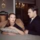 Beautiful young romantic couple in elegant classic clothes lying on a... (thumbnail)